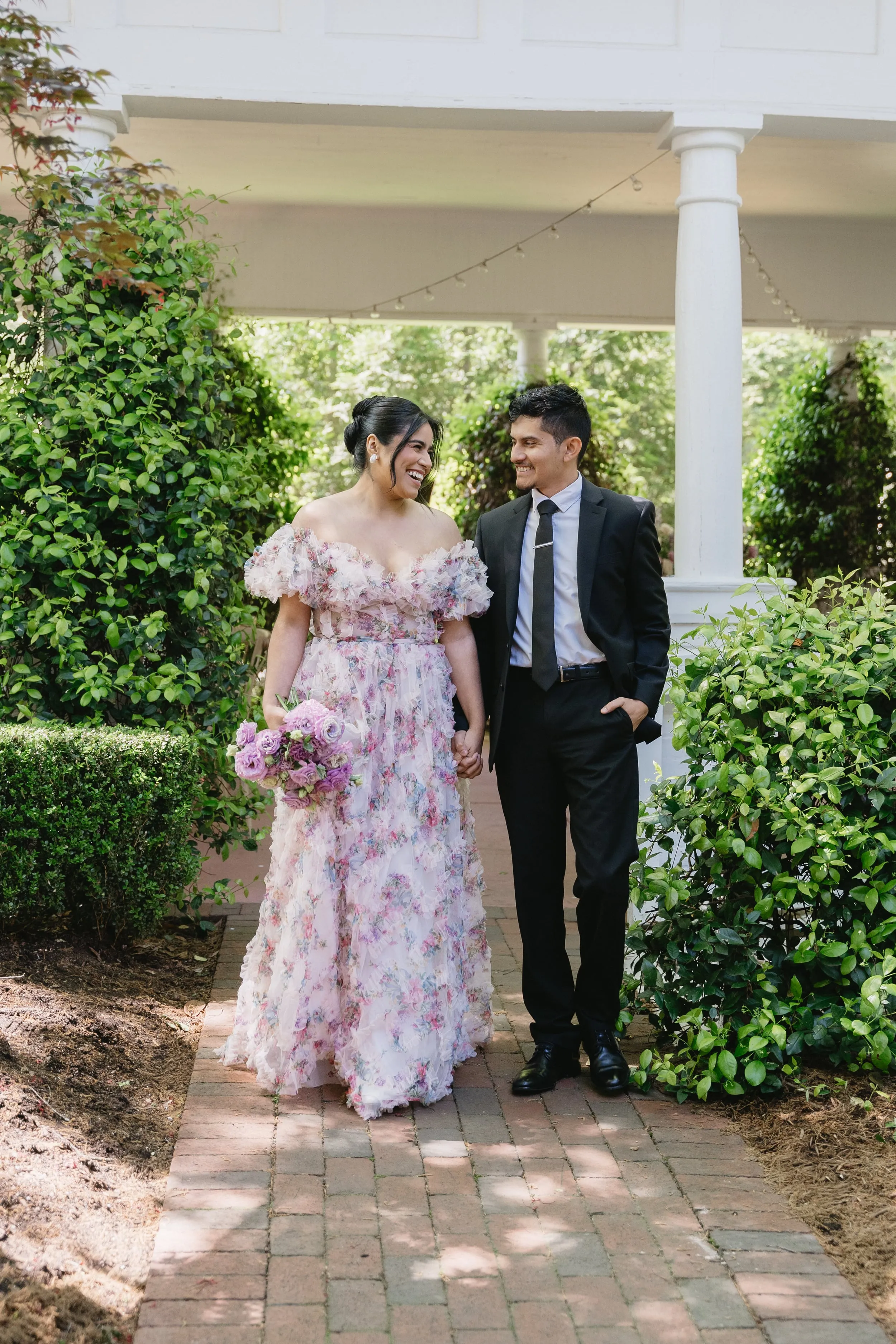 Couple strolling together during engagement session in NC