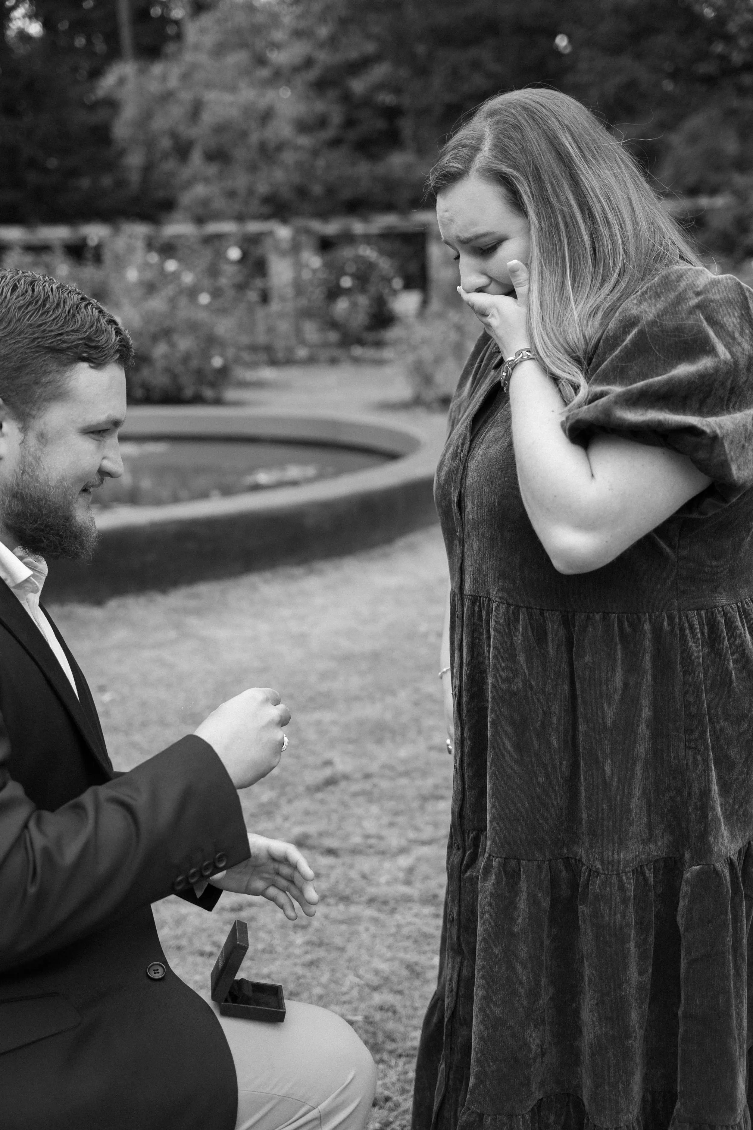 Engagement portrait — couple laughing in natural light
