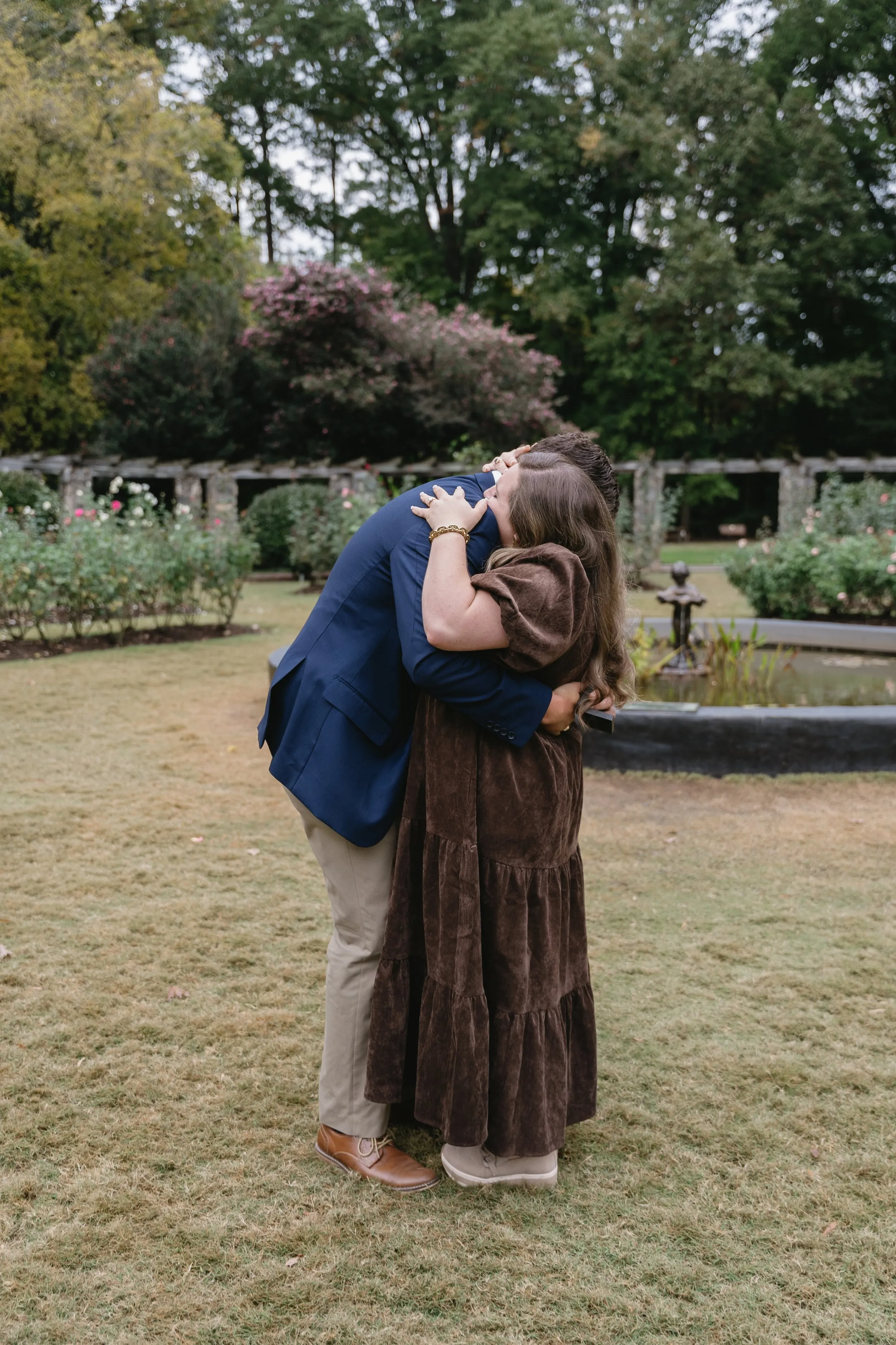 Couple embracing during outdoor engagement session