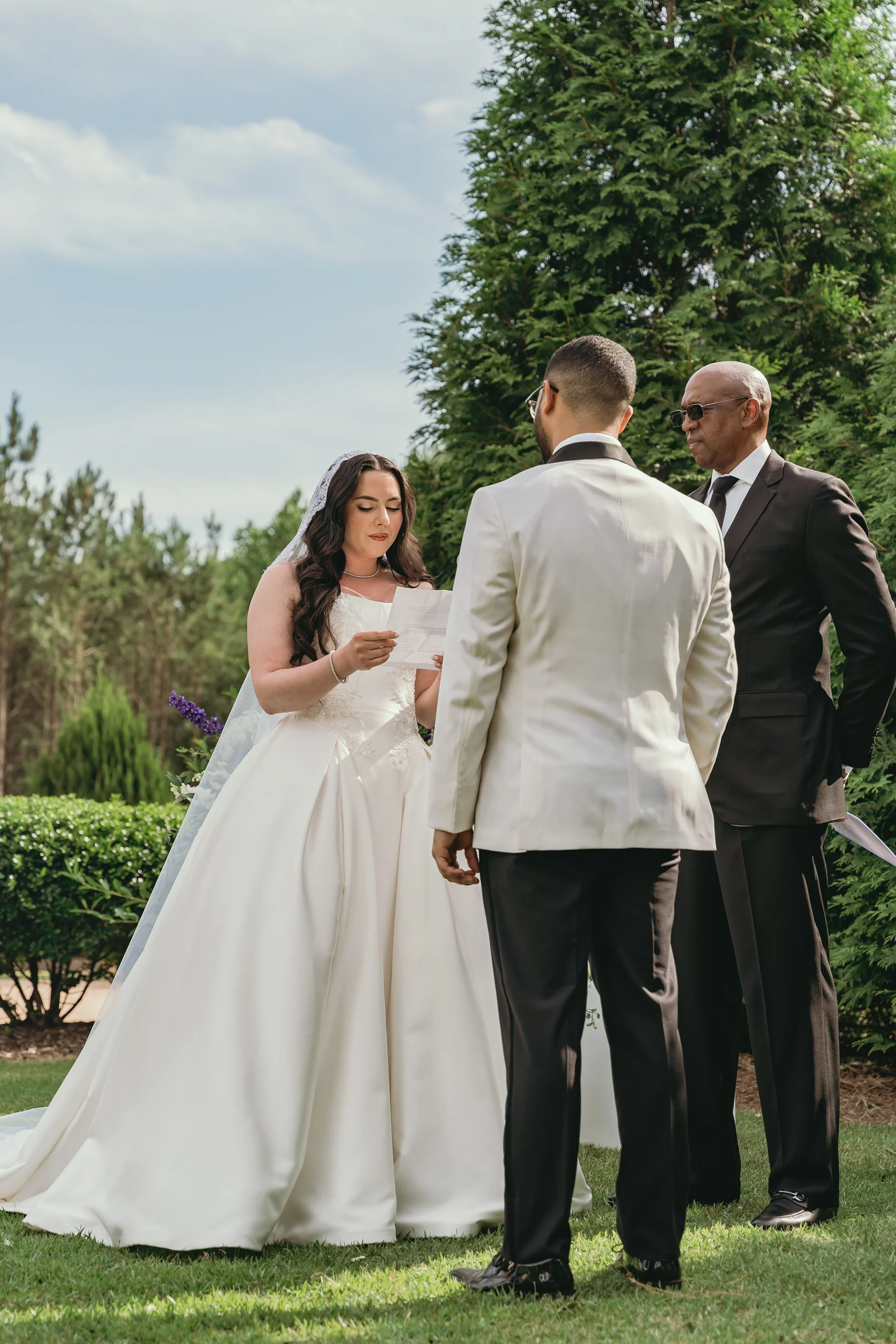 A beautifully captured wedding moment — bride and groom surrounded by warm, cinematic light
